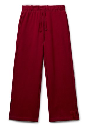 Bordeauxfarbene Sweatpants mit weitem Bein, elastischem Bund, Kordelzug, Seitentaschen, kleinen seitlichen Schlitzen und einem "DREAM"-Label nahe dem Saum.