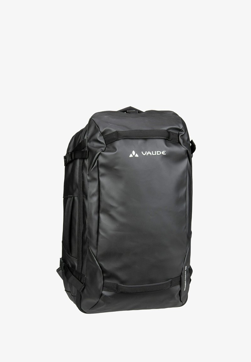 Sac à dos noir en matériau durable, de forme rectangulaire, avec des bretelles réglables et un logo sur le devant. Des compartiments zippés sont visibles.