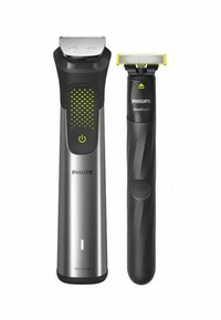Philips Pflege-Set mit einem silbernen und schwarzen Trimmer mit grünen Akzenten sowie einem kompakten schwarzen OneBlade-Rasierer mit einer gelben Spitze.