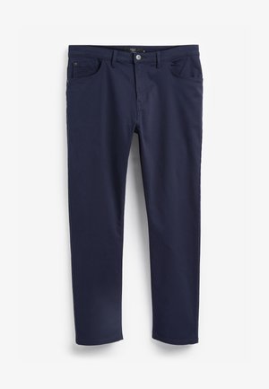 Chinos bleu marine en coton, avec une taille plate, cinq poches et une fermeture éclair avec bouton. Texture lisse, design à jambes droites.
