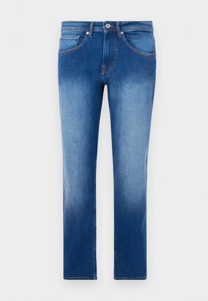 Lyseblå jeans med en gradvis falmning, lige ben, fem lommer og kontrastfarvet orange syninger langs sømmene. Klassisk denimtekstur.