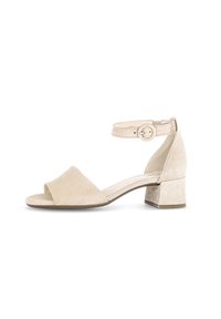 Beige Wildleder-Absatzsandalen mit offenen Zehen, Riemchen am Knöchel und Blockabsatz. Verfügt über eine glatte Textur und eine verstellbare Schnalle.
