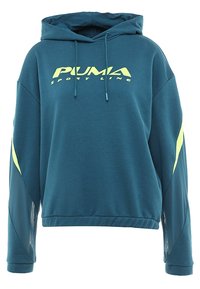 Felpa con cappuccio color verde petrolio con cordino, logo PUMA giallo e accenti gialli a contrasto sui lati. Realizzata in tessuto morbido con una vestibilità rilassata.