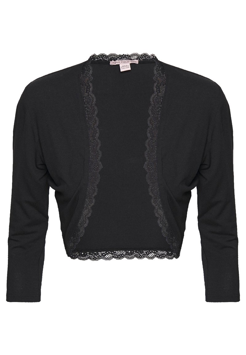 Černý krátký svetr z měkkého materiálu s vroubkovanou krajkovou výšivkou podél otevřeného předního dílu a rukávů. Dlouhé, přiléhavé rukávy.
