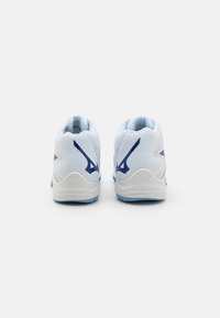 White and light blue athletic shoes featuring mesh upper, a textured design, and contrasting blue accents on the heel and sides.