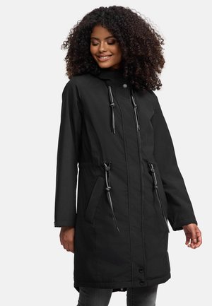 Black long jacket with a hood, drawstrings, front pockets, and button closure. Made from a smooth, water-resistant material.