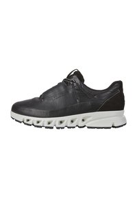 Sorte lærersneaker med en teksturert overdel, elastiske snorer og en hvit mellomsåle med fremtredende dempeputer og svart gummisåle.