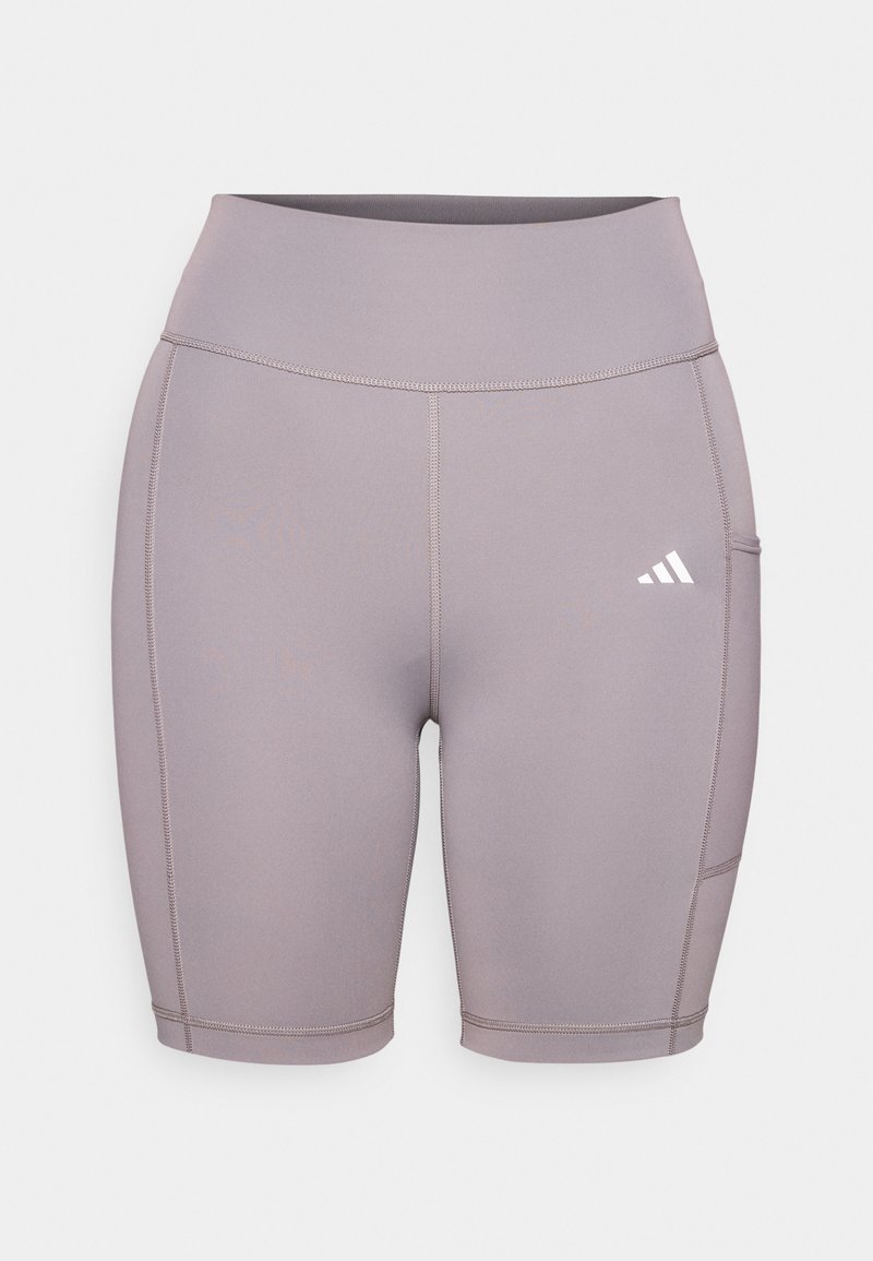 Pantalones cortos de bicicleta elásticos en color lavanda con una cintura alta. Presenta costuras planas y un bolsillo lateral. Logotipo de Adidas notable en blanco en la parte inferior izquierda.