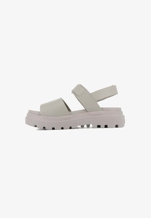 Gray leather sandal with wide cross straps, padded footbed, and a thick light pink rubber sole featuring a textured, chunky tread design.