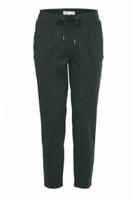 Donkergroene taps toelopende joggingbroek met elastische tailleband en verstelbaar trekkoord, met zijzakken en een relaxte pasvorm.
