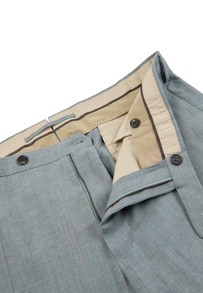 Light gray dress pants with zipper, button closure, beige inner waistband, and inside button detail, shown partially open on white background.