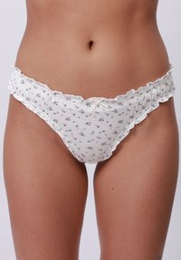 Witte bloemenbikini met kleine roze en groene patronen, geschulpte randen en een delicate tailleband. Gemaakt van zachte, rekbare stof.