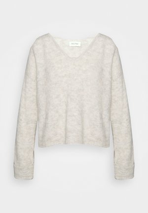 Kergelt hall V-kaelusega lühikene sviiter, mis on valmistatud pehmest kudumisest ja omab tekstuurset viimistlust. Omab pikki varrukasid ja soonikkoes krae.