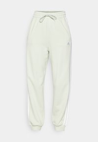 adidas Sportswear ESSENTIALS 3-STRIPES LOOSE-FIT - Tepláky - linen green