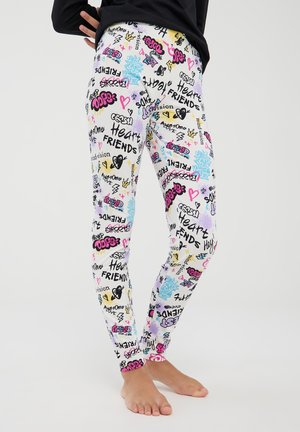 Leggings a fantasia con un design colorato che presenta testo grafico nero, rosa, giallo e blu, cuori e forme su uno sfondo bianco.