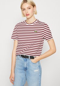 Lacoste Apdrukāts T-krekls - zin/flour