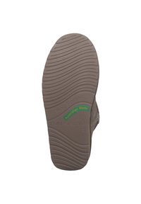 Suola in gomma marrone con grip testurizzato caratterizzato da linee ondulate. Le marcature indicano "Resistente all'acqua" e "EMU Australia" con accenti verdi e gialli.