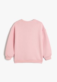 Roze sweatshirt met een zachte textuur, ronde hals en een design met schoudervallen. Heeft ribgebreide manchetten en zoom voor een ontspannen pasvorm.