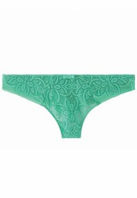 String vert en dentelle avec un motif floral, des bords festonnés et une taille lisse. Matériau léger avec une finition transparente.