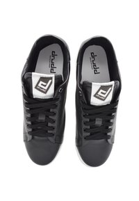 Black leather sneakers with a smooth texture, round toe, and white accents. Features black laces and a branded tongue label.