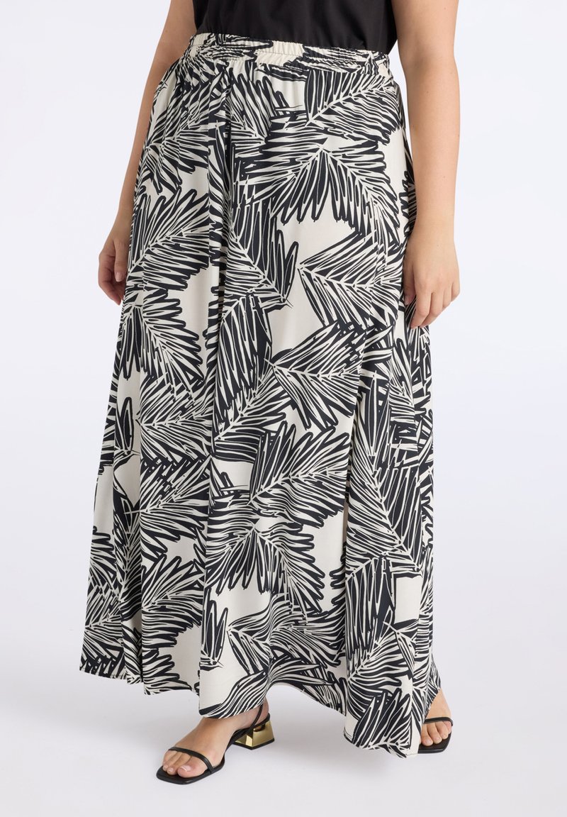 Gonna lunga in tessuto leggero con un motivo a foglie di palma in bianco e nero, una vita elastica e una silhouette ampia.