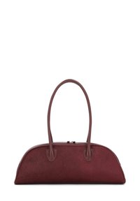 Burgundy handbag with smooth leather accents. Rounded shape, dual handles, and a zipper closure. Textured body resembling fur.