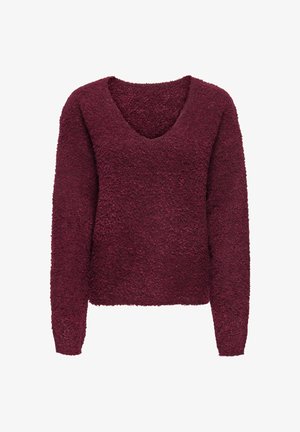 Bordeaux sweater met lange mouwen, V-hals en textuurpluche stof. Heeft een losse, cropped pasvorm en een zachte, fuzzy uitstraling.