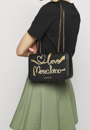 Black leather handbag with gold "Love Moschino" script. Includes a chain strap and sleek rectangular design, set against a plain background.