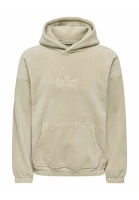 Beżowa bluza z polaru z kapturem, kangurkową kieszenią, ściągaczami na rękawach i regulowanym kapturem ze sznurkiem. Na przodzie znajduje się wytłoczony napis "LES CLASSIQUES".