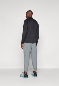 Nike Performance FORM PANT - Pantalones deportivos - smoke grey/black