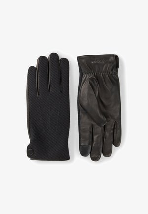 Schwarze Lederhandschuhe mit einer strukturierten Stoffrückseite und glatten Handflächen, ausgestattet mit einem elastischen Handgelenk und einem kleinen Logodetail.