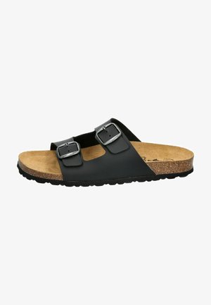Black slide sandal with two adjustable buckles, cork footbed, and textured rubber sole. Smooth upper material with a minimalist design.
