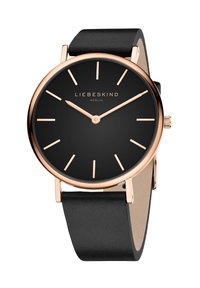 Zwarte polshorloge met een soepel leren band. Ronde kast in roségoud met een minimalistische zwarte wijzerplaat en roségouden uurmarkeringen.