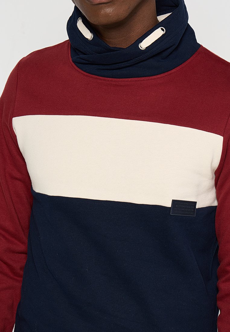 Katoenen sweatshirt met rode, crèmekleurige en marineblauwe horizontale strepen, een hoge kraag met koordjes en een klein logo-opdruk aan de onderzijde.