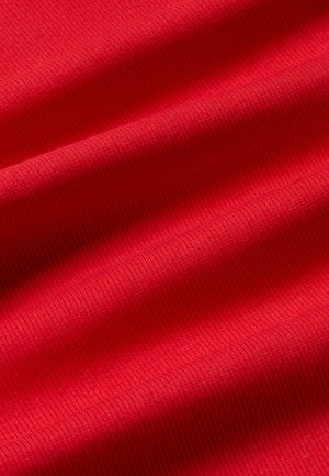 Red textured fabric with a ribbed pattern, featuring smooth contours and consistent color throughout. Soft and flexible material.