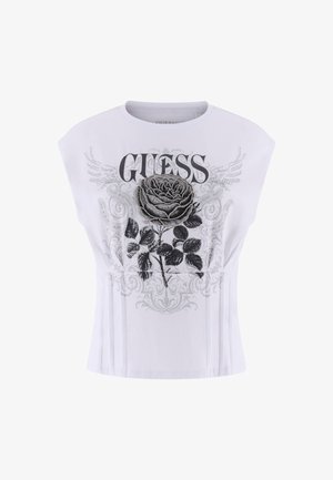 White short-sleeve t-shirt featuring a floral graphic design with a black rose, silver accents, and bold "GUESS" text in black and gray.