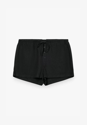 Shorts décontractés noirs avec ceinture élastique, cordon de serrage et fermeture à trois boutons sur le devant, posés à plat sur un fond blanc.