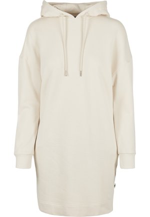 Cream-colored hooded sweatshirt dress, featuring a loose fit, long sleeves, drawstring hood, and ribbed cuffs. Smooth, soft texture.