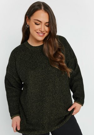 Suéter verde de punto con una superficie texturizada, cuello redondo y mangas largas. Corte holgado con un dobladillo ligeramente curvado.