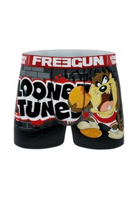 Shorts de boxer noirs arborant le personnage Taz des Looney Tunes dans des couleurs vives. Le texte indique "Looney Tunes", avec une ceinture rouge portant l'inscription "FREECUN".