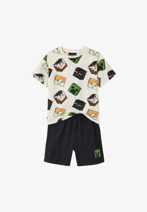 Children's two-piece outfit with white T-shirt covered in Minecraft character heads and black shorts with a small Creeper face.