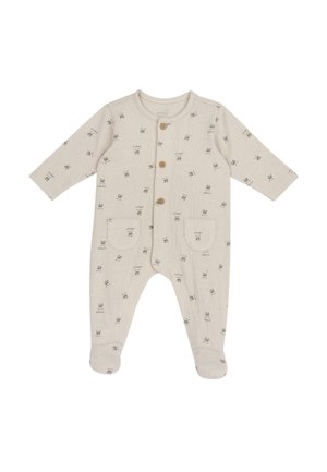 Combinaison à manches longues en tissu beige clair avec un motif texturé de petits lapins, comportant quatre boutons en bois et deux poches avant.