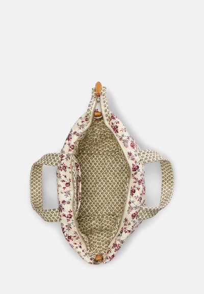 Gėlėtas kremo spalvos krepšys su raudonomis ir žaliomis gėlėmis. Uždarymas užtrauktuku ir dvi rankenos. Viduje yra tekstūruotas gėlių raštas. Minkšta audinio medžiaga.