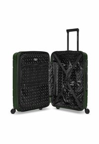 Valigia rigida verde con manico retrattile, tasche interne con zip e cinghie incrociate. Fodera interna nera a fantasia.