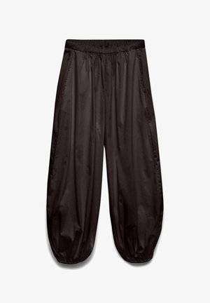 Pantalon noir ample avec ceinture élastique et poignets élastiques froncés, fabriqué en tissu léger et brillant.