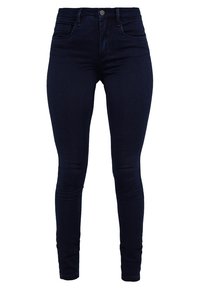 Dark blue skinny jeans made from denim, featuring a classic five-pocket design and a zip-fly with a button closure. Smooth texture.