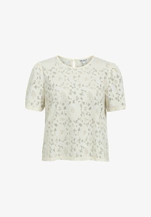 Blouse en dentelle crème à manches courtes avec motif floral, col rond, manches légèrement bouffantes et fermeture par boutons au dos.