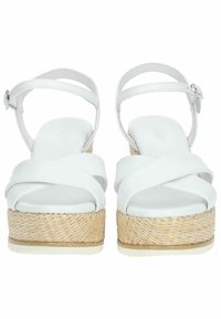 Sandali platform bianchi con cinturini, con suola intermedia in juta intrecciata, punta rotonda e tomaia in materiale sintetico liscio caratterizzata da ampi cinturini incrociati.