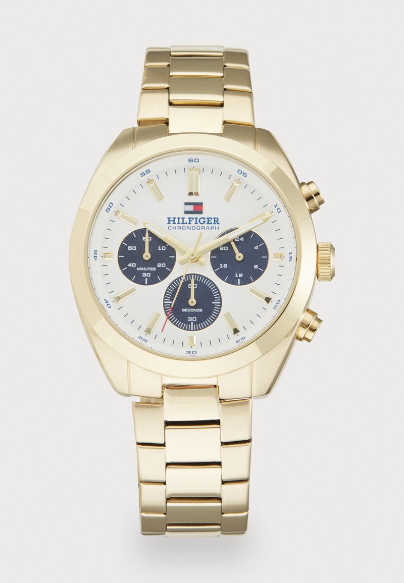 Gold-tone chronograph watch featuring a white dial with blue subdials, gold hour markers, and a link bracelet design.