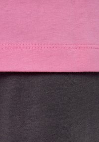 Two layered fabric sections: a pink upper layer with a smooth texture, and a dark gray lower layer with a slightly ribbed texture.